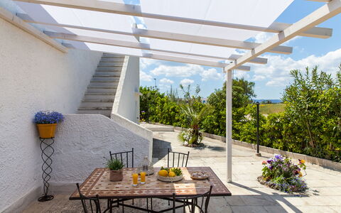Villa Fontanelle: Plant, Table, Furniture, Building, Property, Shade, Chair, Interior Design, Sky, Outdoor Furniture
