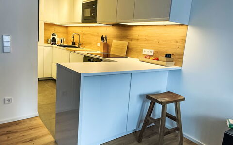 Auszeit: Countertop, Kitchen, Furniture, Interior Design, Flooring, Cabinetry, Kitchen Appliance, Floor, Wood, Major Appliance