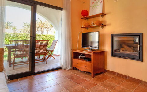 Green Garden & House Pals Beach: Picture Frame, Furniture, Television, Cabinetry, Wood, Window, Interior Design, Architecture, Living Room, Flooring