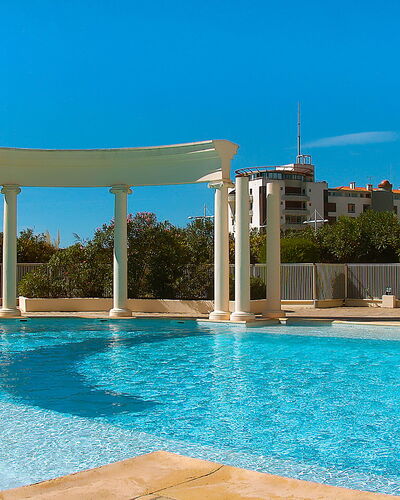 Les Colonnes de Circé: Water, Sky, Plant, Property, Swimming Pool, Azure, Building, Rectangle, Shade