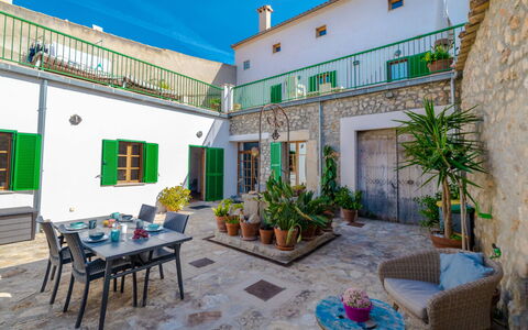 Can Canto: Table, Property, Furniture, Window, Building, Sky, Plant, Flowerpot, Blue, Azure