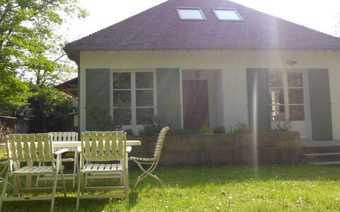 Sunny Lodge: Plant, Building, Property, Window, Sky, House, Chair, Shade, Land Lot, Architecture