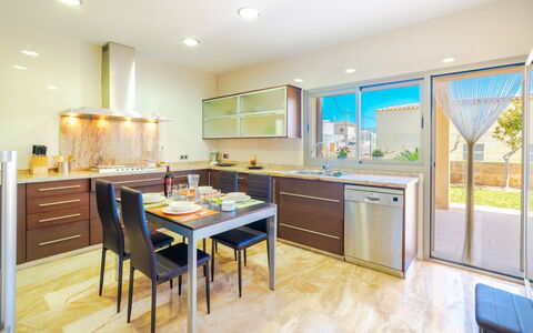 Son Jil: Furniture, Room, Property, Kitchen, Cabinetry, Interior Design, Building, Countertop, Floor, Real Estate