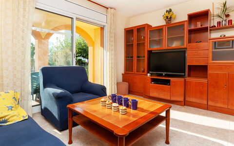 Villa Formentera: Furniture, Room, Living Room, Property, Interior Design, Orange, Building, Table, Coffee Table, Yellow