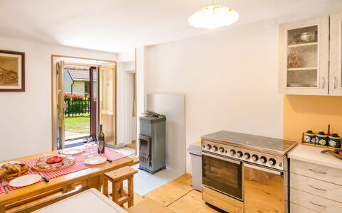 Maja: Picture Frame, Cabinetry, Countertop, Wood, Kitchen Appliance, Table, Lighting, Drawer, Kitchen Stove, Kitchen