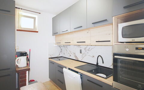 Lolita: Countertop, Kitchen, Kitchen Appliance, Cabinetry, Flooring, Wood, Interior Design, Major Appliance, Furniture, Floor
