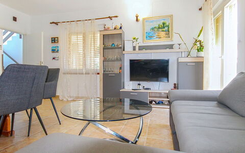 Lolita: Furniture, Interior Design, Couch, Flooring, Table, Floor, Living Room, Ceiling, Room, Chair