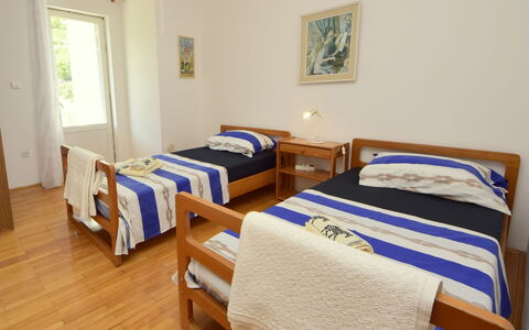 Lolita: Bed, Bedroom, Furniture, Room, Bed Sheet, Bed Frame, Property, Bedding, Wall, Hardwood