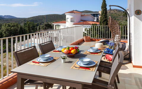 Can Gy: Table, Sky, Building, Property, Furniture, Cloud, Tableware, Azure, Outdoor Table, Wood