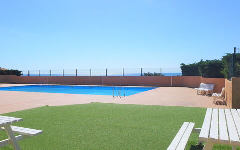 Saint Pierre la Mer 110: Sky, Property, Water, Tree, Plant, Swimming Pool, Outdoor Furniture, Grass, Shade, Flooring