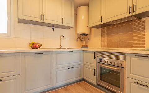 Dénia 479: Kitchen, Cabinetry, Countertop, Kitchen Appliance, Interior Design, Flooring, Wood, Major Appliance, Furniture, Cupboard
