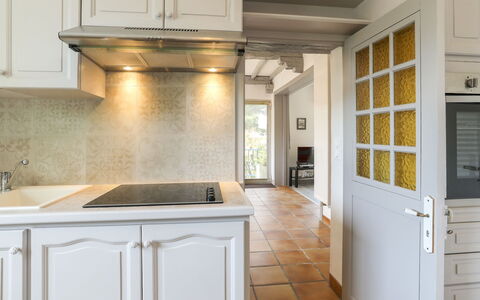 Saint Palais sur Mer 148: Countertop, Cabinetry, Room, Property, Kitchen, Furniture, Interior Design, Tile, Building, Yellow