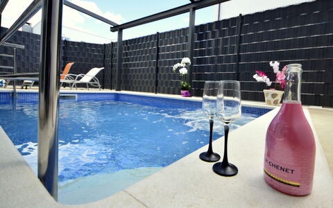 Marin: Water, Property, Building, Swimming Pool, Sky, Chair, Shade, Leisure, Bottle, Condominium