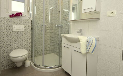 Marin: Bathroom, Property, Room, Tile, Toilet, Plumbing Fixture, Bathroom Accessory, Wall, Floor, Toilet Seat