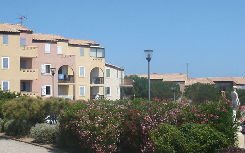 Saint Pierre la Mer 400: Sky, Plant, Building, Window, Flower, Street Light, Land Lot, Residential Area, Urban Design, Neighbourhood