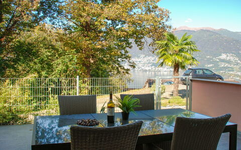 Magadino 75: Sky, Plant, Property, Table, Furniture, Building, Nature, Shade, Chair, Outdoor Furniture
