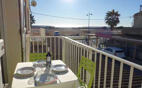 Vicente: Sky, Table, Furniture, Tableware, Building, Light, Chair, Tree, Wine Glass, Street Light