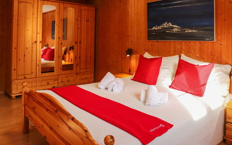 Haus Chumma Apt1: Property, Furniture, Comfort, Wood, Orange, Interior Design, Bed Frame, Cabinetry, Wall, Floor