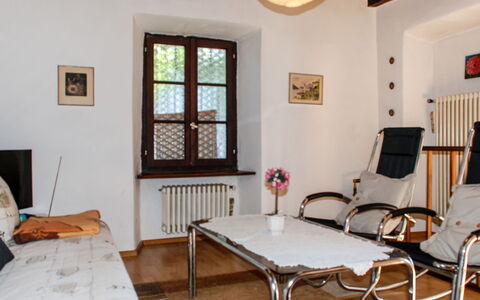 Verzaschina: Furniture, Property, Table, Window, Comfort, Lighting, Wood, Interior Design, Picture Frame, Living Room