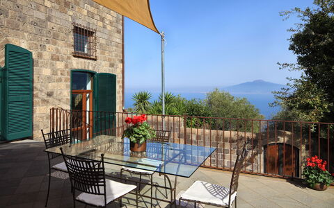 Stony Villa Volcano View: Plant, Building, Furniture, Sky, Property, Table, Flowerpot, Blue, Houseplant, Chair