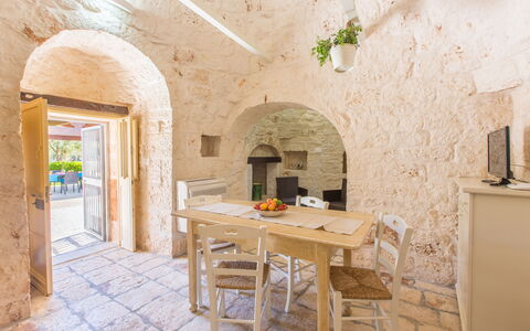 Trullo Del Pioppo Gigante: Table, Furniture, Wood, Architecture, Interior Design, Brick, Floor, Flooring, Building, Real Estate