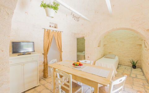 Trullo Del Pioppo Gigante: Furniture, Property, Table, Cabinetry, Building, Wood, Chair, Plant, Interior Design, Houseplant