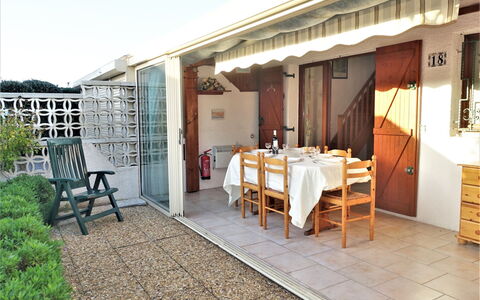 L'Hacienda: Table, Plant, Furniture, Sky, Interior Design, Wood, Building, Door, Shade, Residential Area