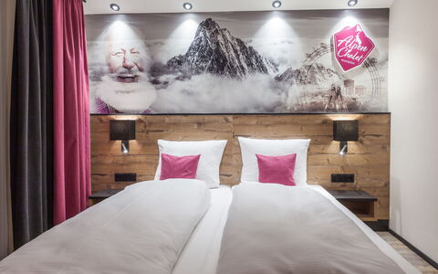 Montafon: Bedroom, Bed, Room, Furniture, Interior Design, Pink, Property, Wall, Bed Frame, Lighting