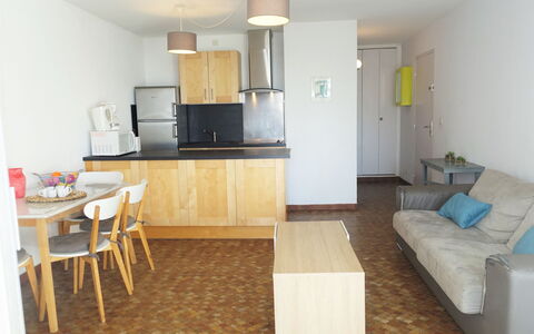 Maisons sur la Plage: Cabinetry, Furniture, Countertop, Table, Chair, Wood, Floor, Flooring, Drawer, Building