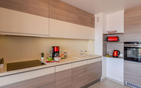 Etoile de Mer: Cabinetry, Countertop, Property, Kitchen Stove, Kitchen Appliance, Building, Wood, Lighting, Orange, Kitchen