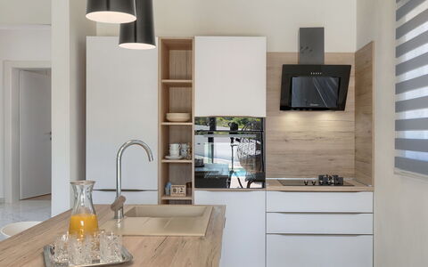 Vine: Countertop, Cabinetry, Property, Furniture, Tableware, Tap, Kitchen, Table, Wood, Interior Design