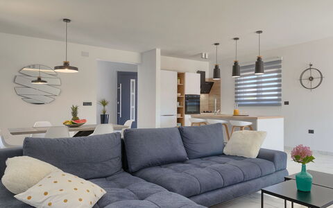 Vine: Table, Couch, Property, Furniture, Lighting, Pillow, Studio Couch, Living Room, Interior Design, Picture Frame
