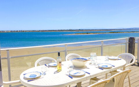 Laguna Beach: Water, Sky, Table, Furniture, Property, Chair, Azure, Blue, Outdoor Furniture, Building