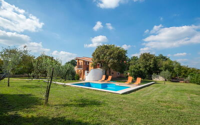 Pula Krnica 120: Property, Sky, Grass, Natural Landscape, House, Real Estate, Cloud, Home, Swimming Pool, Architecture