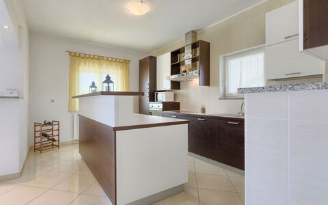 Melian: Cabinetry, Countertop, Furniture, Building, Kitchen, House, Wood, Interior Design, Houseplant