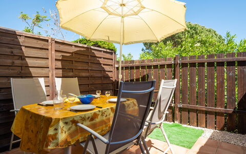 Gruissan 850: Table, Furniture, Property, Umbrella, Chair, Sky, Shade, Outdoor Table, Wood, Outdoor Furniture