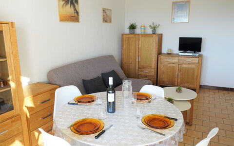 Narbonne-Plage 120: Table, Food, Furniture, Bottle, Tableware, Cabinetry, Picture Frame, Wood, Interior Design, Orange