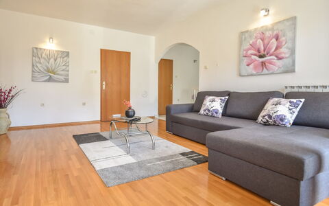 Aurora: Couch, Table, Furniture, Picture Frame, Wood, Plant, Architecture, Lighting, Interior Design, Living Room
