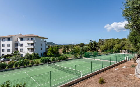 Porto Vecchio 140: Sky, Plant, Property, Cloud, Building, Window, Land Lot, Tree, Tennis, Grass