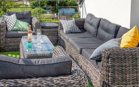 Villa Kerhostin: Furniture, Property, Living Room, Room, Coffee Table, Couch, Wicker, Interior Design, Studio Couch, Table