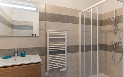 Porto Vecchio 116: Property, Plumbing Fixture, Bathroom, Shower Door, Tap, Shower, Mirror, Floor