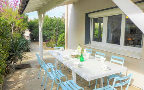 Les Vives: Table, Furniture, Plant, Chair, Flowerpot, Building, Shade, Wood, Cottage, Interior Design