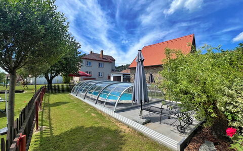 Neurazy: Cloud, Sky, Plant, Building, Tree, Land Lot, Urban Design, Neighbourhood, Leisure, Cottage