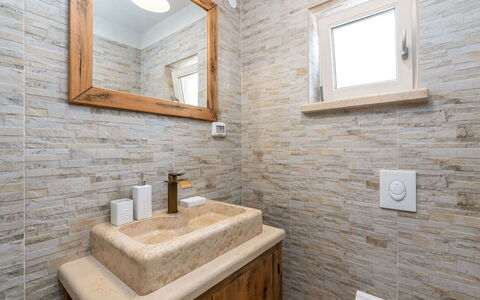 Lucija: Mirror, Building, Property, Tap, Plumbing Fixture, Bathroom, Window, Wood, Lighting