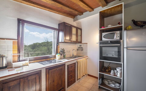 Olivo: Cabinetry, Property, Countertop, Wood, Kitchen, Kitchen Stove, Building, Interior Design, Floor, Wood Stain