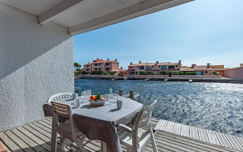 Le Barcarès 180: Water, Table, Furniture, Sky, Chair, Building, Outdoor Furniture, Shade, Wood, Leisure