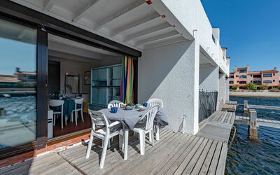 Le Barcarès 180: Water, Furniture, Property, Sky, Building, Chair, Azure, Table, Shade, Wood