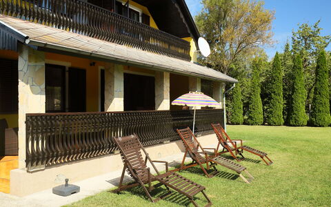 Akazie: Building, Property, Plant, Sky, Shade, Window, Porch, House, Wood, Outdoor Furniture