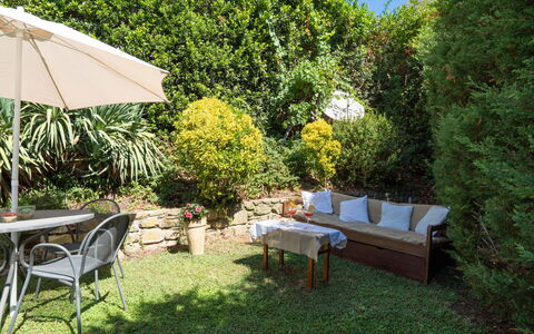 La Vittoria: Table, Plant, Furniture, Plant Community, Shade, Outdoor Table, Outdoor Furniture, Tree, Grass, Natural Landscape