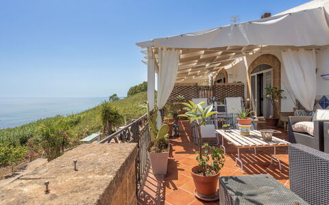 Terrazza del Sud: Sky, Plant, Property, Flowerpot, Chair, Shade, Building, Houseplant, Outdoor Furniture, Seaside Resort